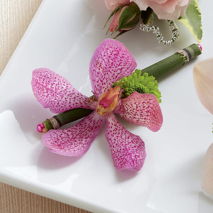 Pink Mokara Boutonniere –  Bella Fleur Sweets And Gifts Inc, Aurora IL