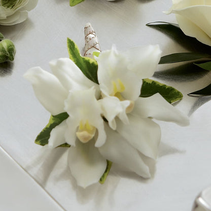 White Mini Cymbidium Boutonniere –  Bella Fleur Sweets And Gifts Inc, Aurora IL
